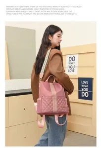 Stylish women's pink nylon quilted backpack with wide patterned strap for daily use.