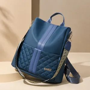 Stylish women's nylon backpack with quilted pocket, anti-theft design and comfortable straps.