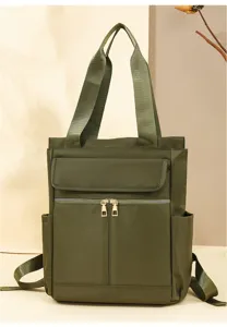 Vue détaillée du sac à dos cabas en nylon vert kaki, avec double poignée et poche avant zippée.