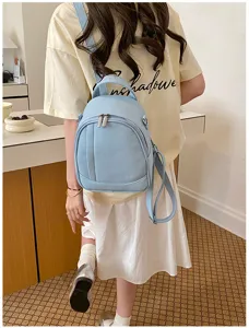 Sac à dos femme en cuir souple bleu clair décontracté voyage quotidien élégant.