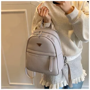 Casual PU leather backpack for women, lightweight travel daypack with multi-zipper compartments.