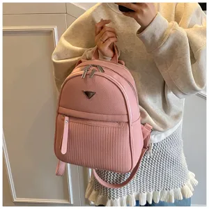 Pink PU leather women backpack stylish casual travel bag with front pocket and metal detail