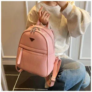 Stylish pink PU leather casual backpack for women, ideal for daily commute, travel, and fashion.