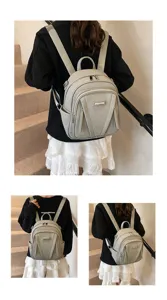 Koreanischer Stil schicker Pendler Rucksack, minimalistisches Design in Grau mit Reißverschlusstasche.