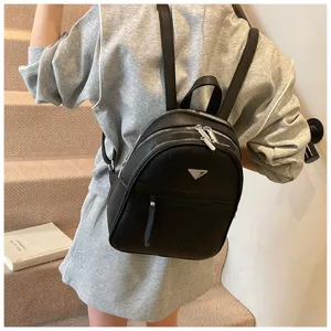 Stylish black PU leather backpack for women, featuring multi-zipper pockets and chic design.