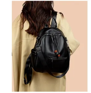Backpack detail view showcasing black PU leather texture, spacious capacity and casual style.