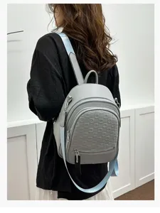 Grey PU leather women backpack with front geometric embossed pattern and light blue straps