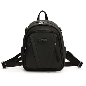 Stylischer schwarzer Canvas Damen Rucksack, lässiges Design mit Metall Logo Plakette.