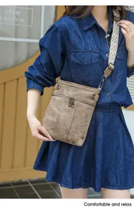 Vintage canvas crossbody bag for women, multi-pocket casual shoulder bag with wide strap.