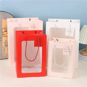 Transparant venster cadeautas papier bloemboeket draagtas verpakking voor feest bruiloft.