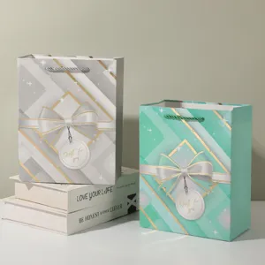 Decorative paper gift bags with bow design for party candy and shopping packaging