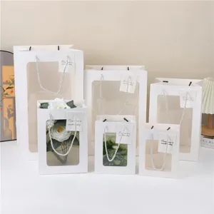 Witte papieren geschenktassen met doorzichtig venster, helder vensterontwerp voor bloemverpakking.