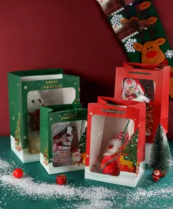 Christmas gift bags with clear windows, paper packaging with plush toys for holiday gifts.