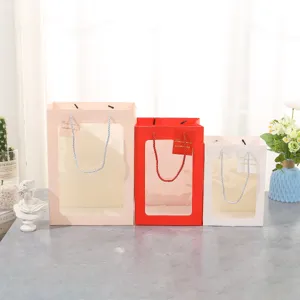 Bolsas de regalo con ventanas transparentes, bolsas de papel decorativas con asas y etiquetas.