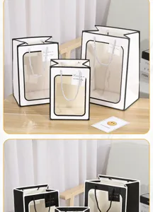 Clear detail shot of transparent window gift bags with black and white borders for parties.