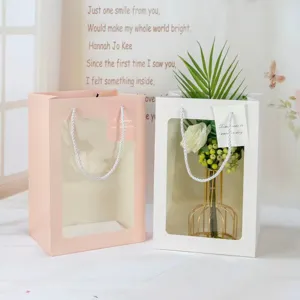 Transparent window paper gift bag with handles, perfect for flower packaging and romantic events.