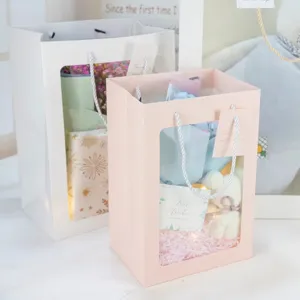 Window paper gift bag for flowers and presents, elegant pink and white tote bag for anniversary.