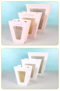 Details van T-vormige trapezoidale bloemengeschenkzakjes met doorzichtig venster, roze, wit.