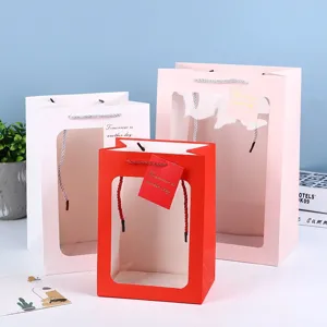 Transparent window paper gift bag with handles for flowers, party favors, and gift packaging.