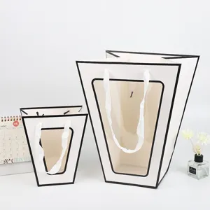 Creatieve T-vormige bloemenverpakking tas met doorzichtig venster en lint handgrepen voor cadeaus.