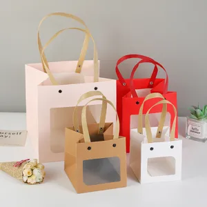 Cute window paper gift bags with handles for packaging cakes, flowers, and small presents.