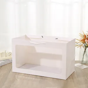 Grande sacchetto regalo in carta bianca con finestra trasparente, confezione orizzontale.