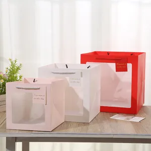 Square transparent window paper gift bag, pink white red floral cake packaging handle bag.