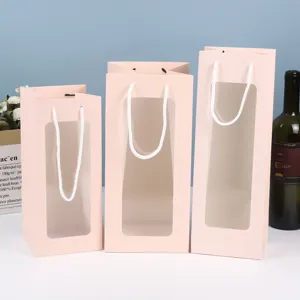 Sacchetti regalo in carta rosa con finestra trasparente, manici eleganti per fiori e confezioni.