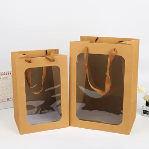 Kraftpapieren draagtas met doorzichtig venster en stoffen handvatten voor bloem en cadeau.