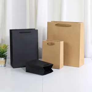 Kraft paper gift bags and black card paper bags set for retail shopping, parties, and packaging.