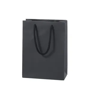 Professional black paper gift bag with sturdy handles, ideal for retail and packing.