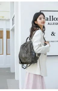 Vintage soft leather backpack for women, large capacity travel school bag with strap.
