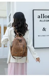 Vintage soft leather backpack for women, large capacity casual travel school bag with stylish straps.