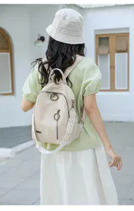 Retro soft leather backpack for women, large capacity versatile travel bag with wide straps.