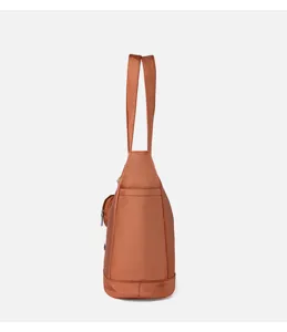 Side detail view of casual brown nylon shoulder tote bag with convenient pockets and long straps.