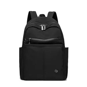 Stylish black nylon backpack for women, large capacity travel and student bookbag.