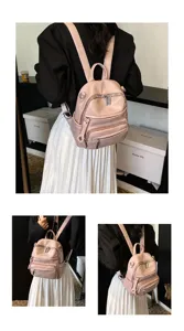 Detail shot of a stylish pink leather women's backpack featuring multiple zipper pockets.