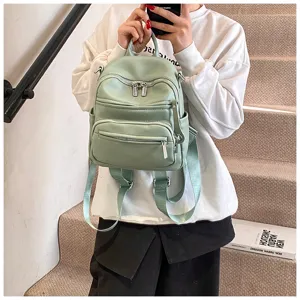 Stylish casual women's PU leather backpack in light green, perfect for daily commute and travel.