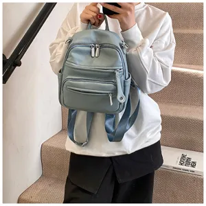 Casual light blue leather backpack for women featuring multiple convenient zipper pockets everyday use