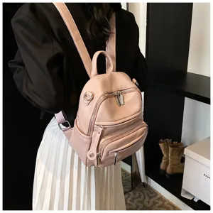 Stylish pink leather backpack for women, casual daily versatile lightweight daypack.