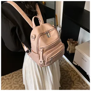 Chic pink leather backpack for women, stylish large capacity casual daily school daypack.