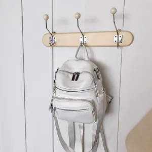 Stylish white leather backpack for women, large capacity and casual daily use main view.