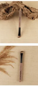 Professional angled eyebrow brush with wood handle for precise eyebrow filling tools.