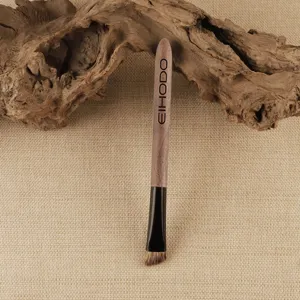 Angled eyebrow makeup brush with wood handle, professional blade brow brush for precise filling.