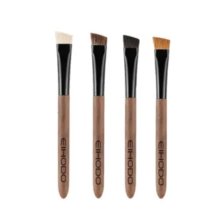 Set of 4 professional angled eyebrow brushes with wooden handles for precise makeup application.