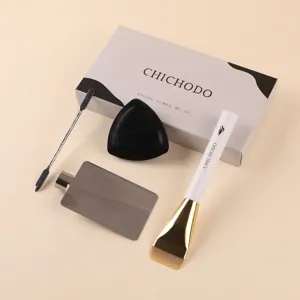 Professional flat foundation brush set with scraper and puff for seamless makeup finish.