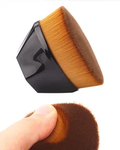 Detailed close-up view of the dense bristle texture and ergonomic handle design of the brush.