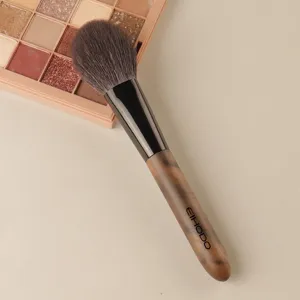 Professional cosmetic makeup brush with soft bristles and wood handle for smooth daily application