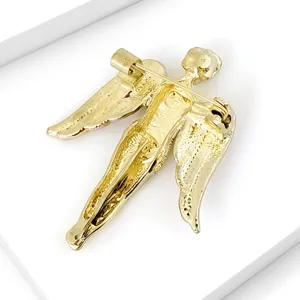 Detailed macro view showing the back structure and pin clasp of a golden angel brooch