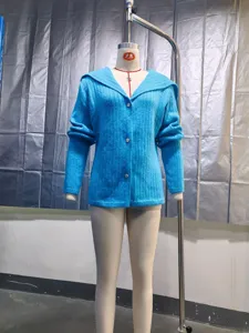 Detail view of a vibrant blue slim-fit ribbed knit cardigan with button closures.